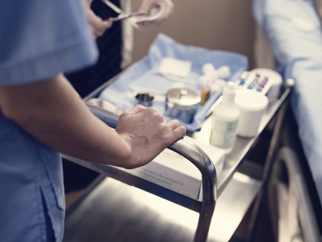 Nurse preparing medical equipments